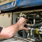 Engineer inspecting commercial vehicle parts