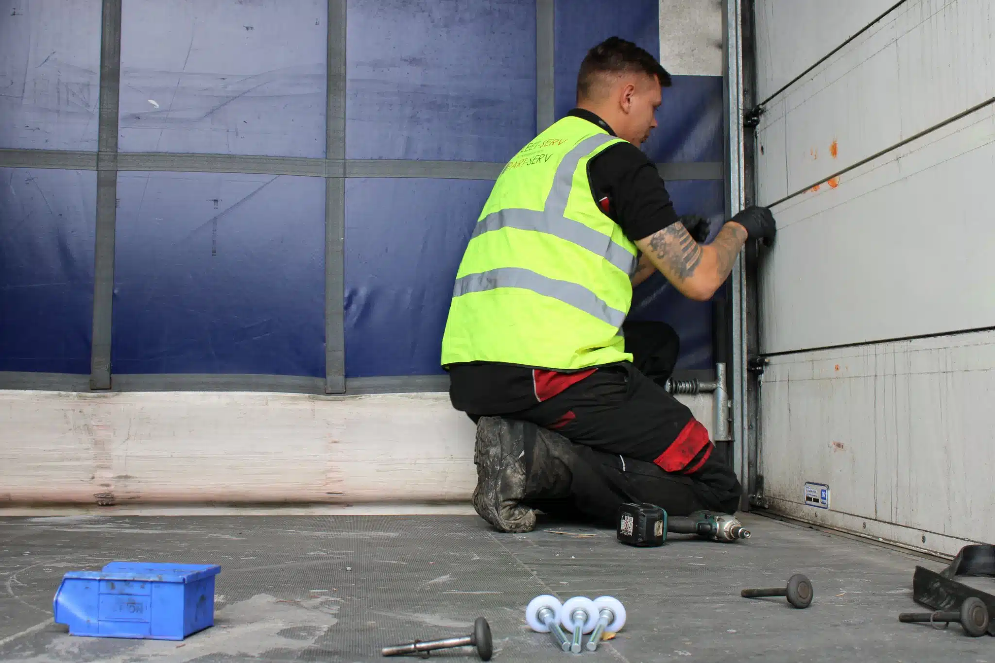Engineer inspecting a commercial vehicle shutter door