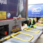Engineer carrying out maintenance on a commercial vehicle tail lift